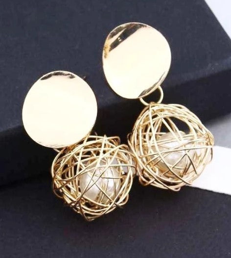 Boucles d'oreille d'inspiration ethnique: Nid de perle