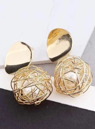 Boucles d'oreille d'inspiration ethnique: Nid de perle