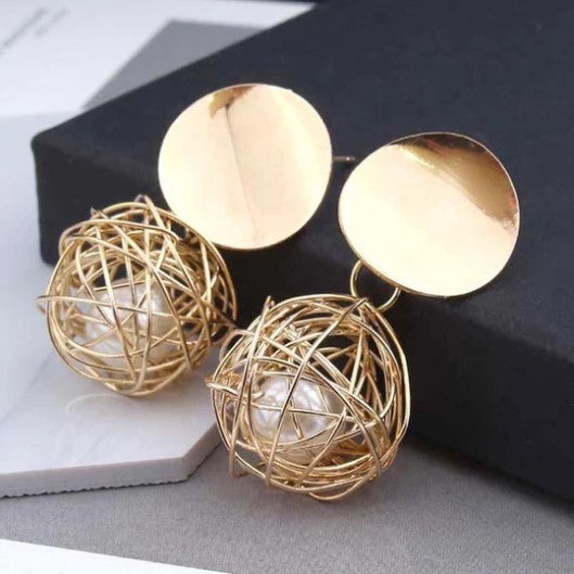 Boucles d'oreille d'inspiration ethnique: Nid de perle